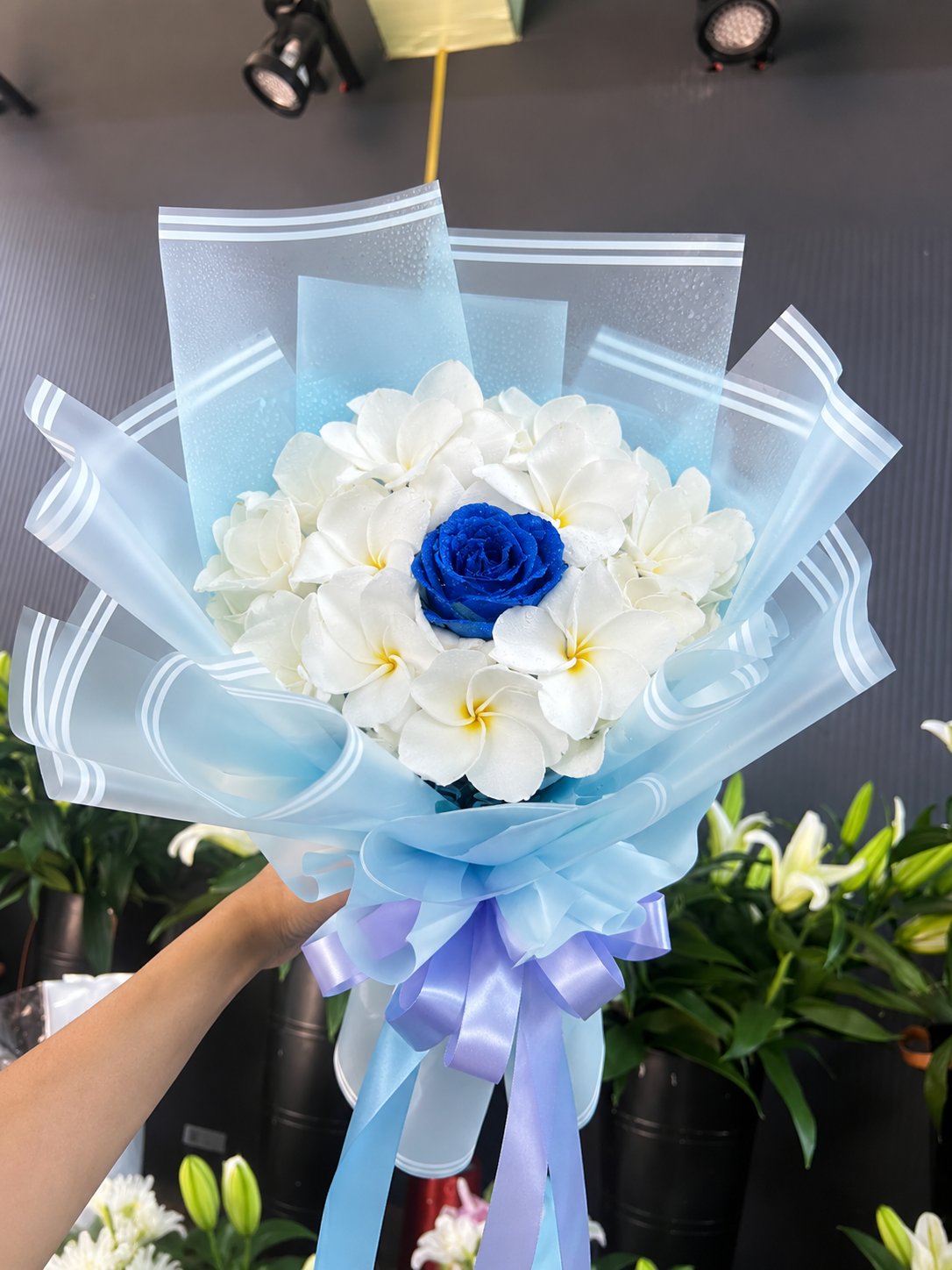 Blue Rose & White Plumeria Bouquet